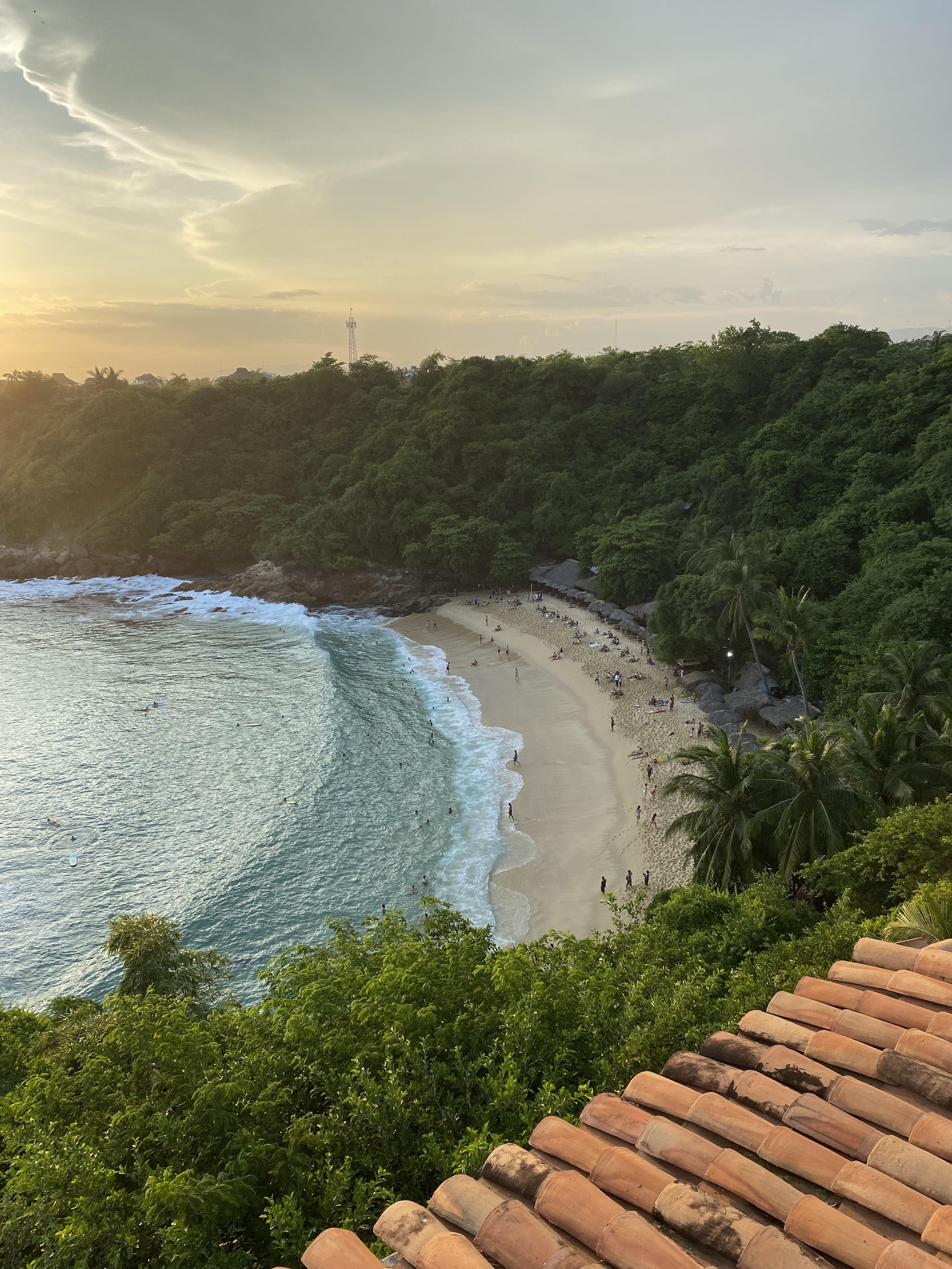 Tropical beach at sunset with gentle waves